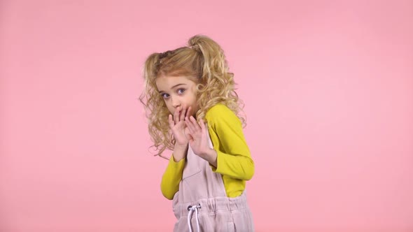 Little Cute Blond Girl Is Scared and Hiding. Slow Motion