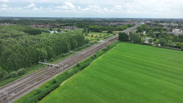 Dutch Moving Commercial Train in Nature Forrest Landscape