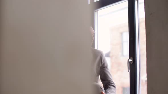 Businessman Calling on Smartphone at Office