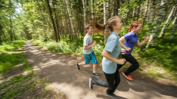 Teenagers Jogging in Wood alt