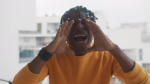 Excited African American Man Shouting WOW Using His Hands To Amplify His Voice