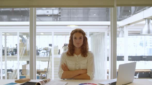 Businesswoman sitting with arms crossed 4k