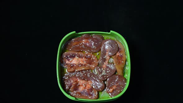 Marinated Meat And Seafood Placed In Green Plastic Container. -medium shot