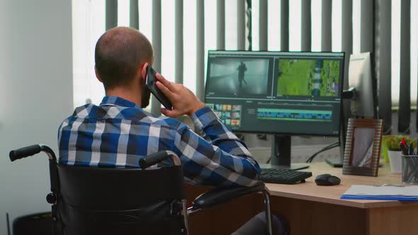 Disabled Freelancer Videographer Talking on Phone