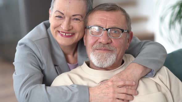 Indore Portrait of a Grayhaired Elderly Married Couple a Man and a Woman Hugging and Looking at the