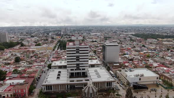 Massive Building Of The Federal Palace And Surrounding Cityscape In Guadalajara Mexico - aerial shot