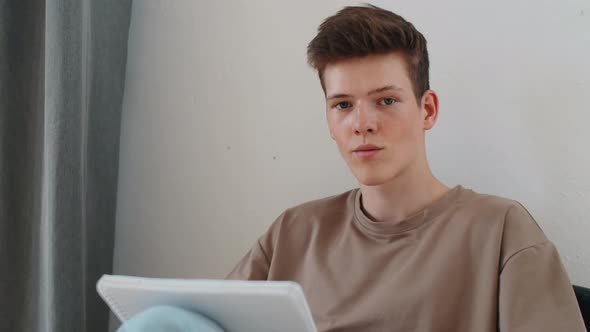 Young Boy Having Online Lesson via Video Call at Home