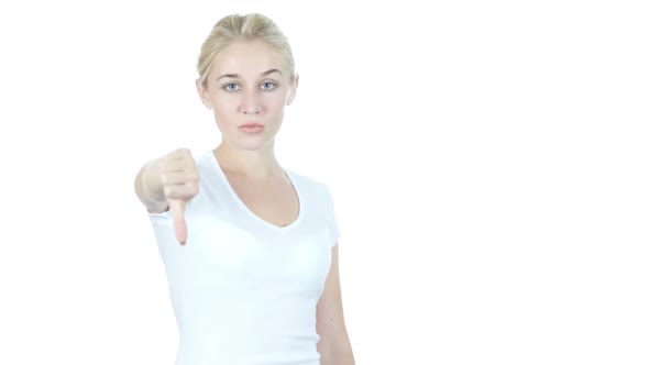 Thumbs Down By Beautiful Young  Woman, White Background