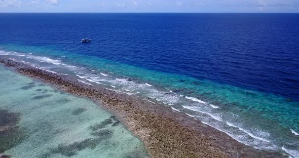 Wide angle flying abstract shot of a summer white paradise sand beach and aqua blue ocean background