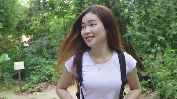 Asian Girl Walking On Forest Trail