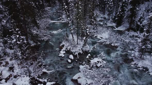 Creek with snow wide trucking pan