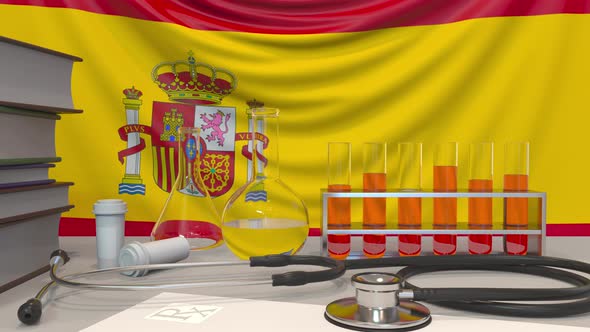 Clinic Laboratory Equipment on Spanish Flag Background