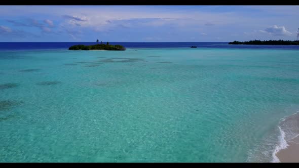 Aerial nature of relaxing lagoon beach lifestyle by blue ocean and white sandy background of a dayou