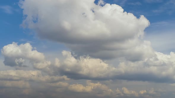 Time Lapse Footage of Fast Moving White Puffy Clouds on Blue Clear Sky