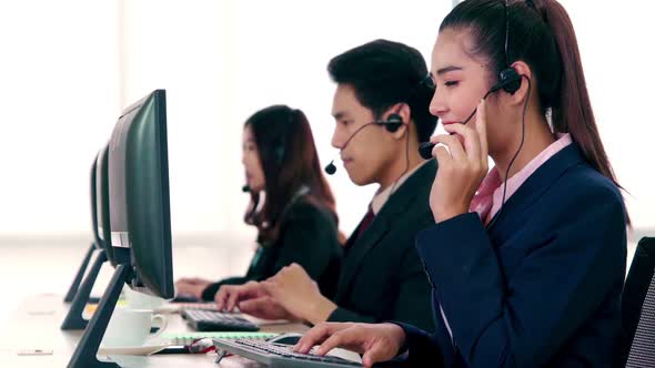 Business People Wearing Headset Working in Office