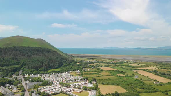 Aerial view of small village near the sea. Glenbeigh village,Meentoag mountain,castlemaine harbour a