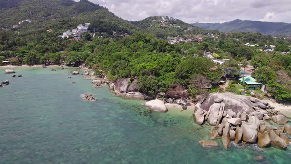 Beautiful 4K drone footage of the beach and unique rock features at Hin Ta Hin Yai Beach on Koh Samu