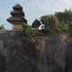 Aerial Flying Low Rising Up Vertically past cliff showing a temple and landscape in Bali - VideoHive Item for Sale