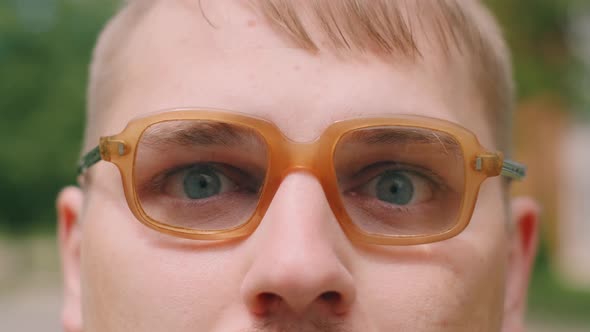 Portrait of Serious Nerdy Man in Glasses