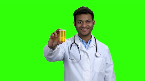 Happy Doctor Showing Pills and Thumb Up