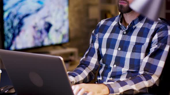 Caucasian Entrepreneur Thinking While Working on His Laptop