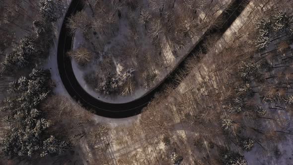 Look up shot from a curvy serpentine street at wintertime up to a popular monastery in southern bava