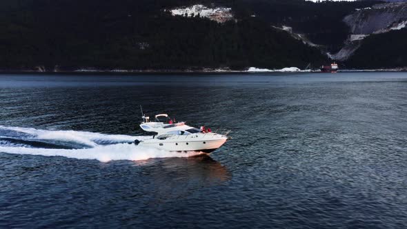 Fast moving motor yacht at the sea.