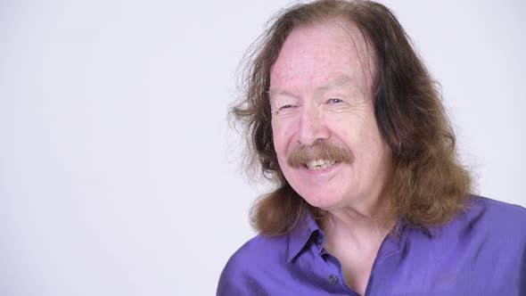 Happy Senior Man with Mustache Wearing Purple Silky Shirt