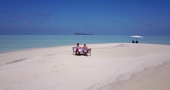 Beautiful boy and girl after marriage in love live the dream on beach on sunny white sandy 4K backgr