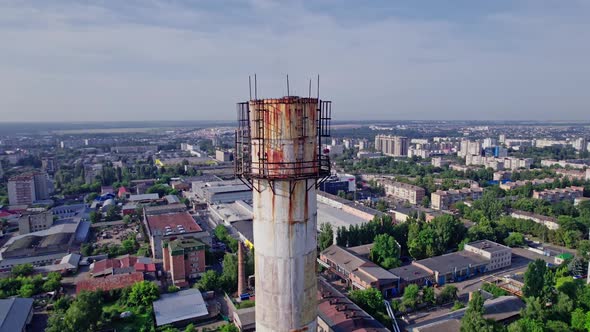 Industrial Plant with Pipes Near the City