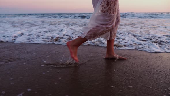 Attractive Woman Enjoying The Beach At Sunset