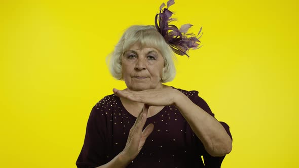 Tired Senior Old Woman Showing Time Out, Pause Gesture Looking at Camera with Upset View, Deadline