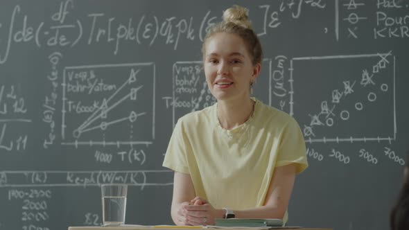 Portrait of Happy Girl in University Classroom