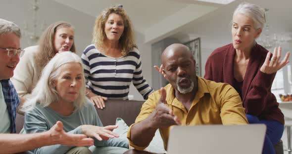 Animation of happy diverse female and male senior friends having video call on laptop