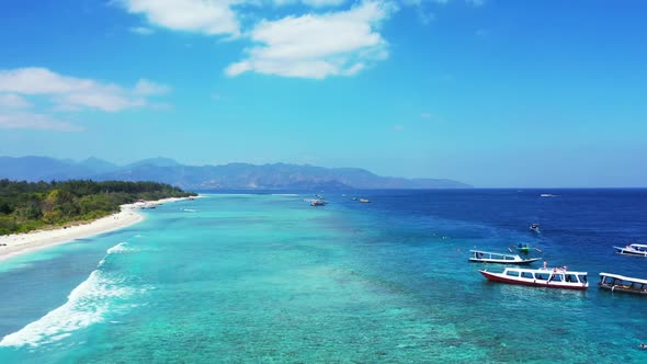 Aerial drone panorama of paradise shore beach journey by blue green water and white sand background 