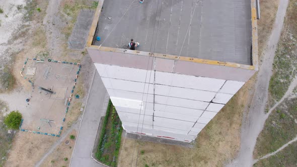 Industrial Alpinism. Aerial View. Work on Outer Insulate Building with Styrofoam