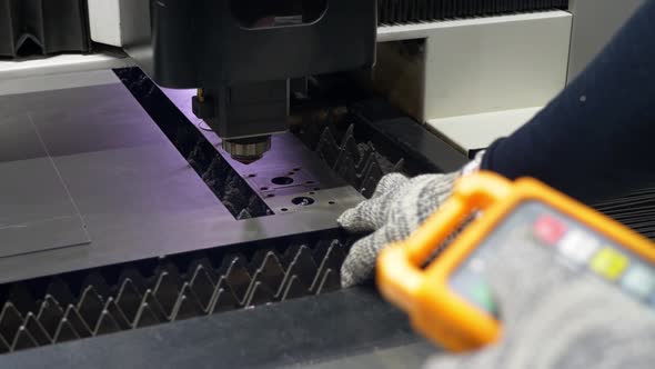 Engineer Controls the Cutting of Metal Plates