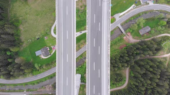 Aerial Top View of Highway Viaduct with Multilane Traffic in Mountains. Autobahn in Austria