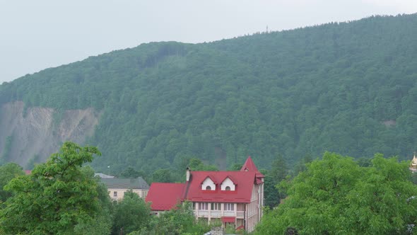 Panoramic Shooting of Mountain Landscape with Rocks and Thick Wood Carpathian Forest in the Haze on