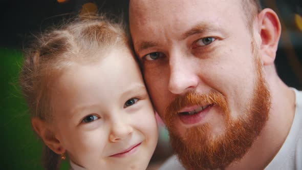 Caucasian Family - a Dad and Daughter - a Man with Ginger Beard