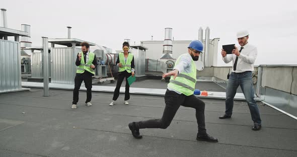 A Bearded Man Dancing Like a Robot