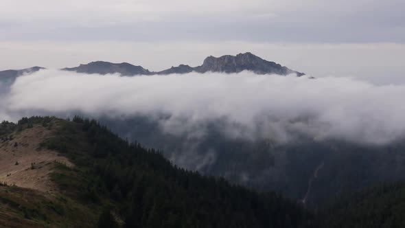 Pan Right Landscape With Mountains And Fog