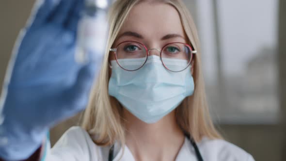 Closeup Female Specialist Chemist Biochemist Woman Doctor Nurse Scientist in Medical Mask Glasses