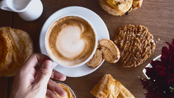 Breakfast with Croissants Pie Cookie and Cup of Coffee on Wooden Table in Cafe