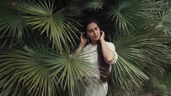 a Young Student Is in Palm Groves, a Lady Has on Hands and Fingers Mehendi Henna