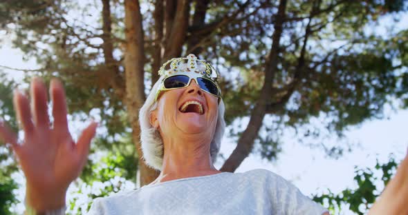 Senior woman wearing party props