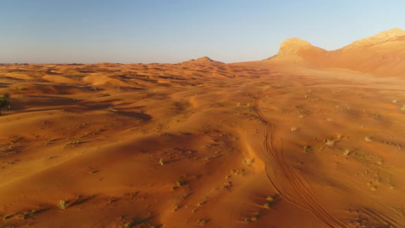 Aerial view of dunes creating shadows at a desert landscape, U.A.E.