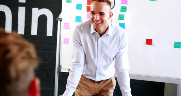 Businessman interacting with coworkers