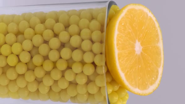 Vertical orientation video: Vitamin C to improve immunity. Ascorbic acid in a dragee