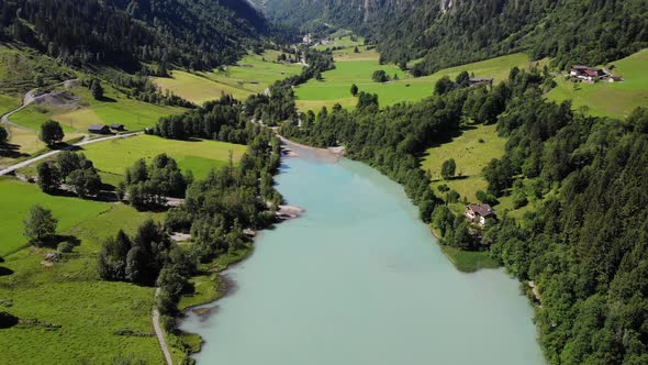Countryside Landscape With Calm Lake Water And Lush Vegetation In Klammsee, Kaprun, Austria - aerial